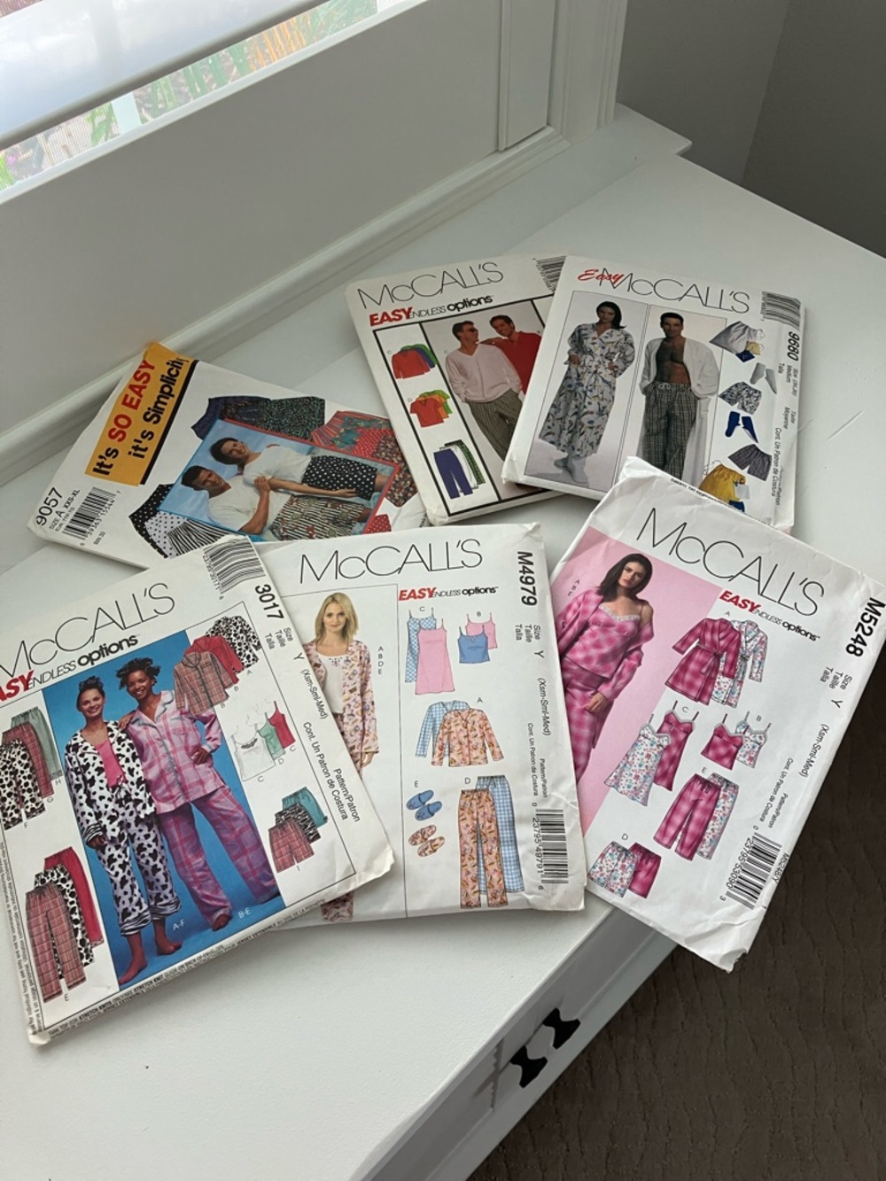 Six uncut sewing patterns, pajamas, sizes extra small to extra large